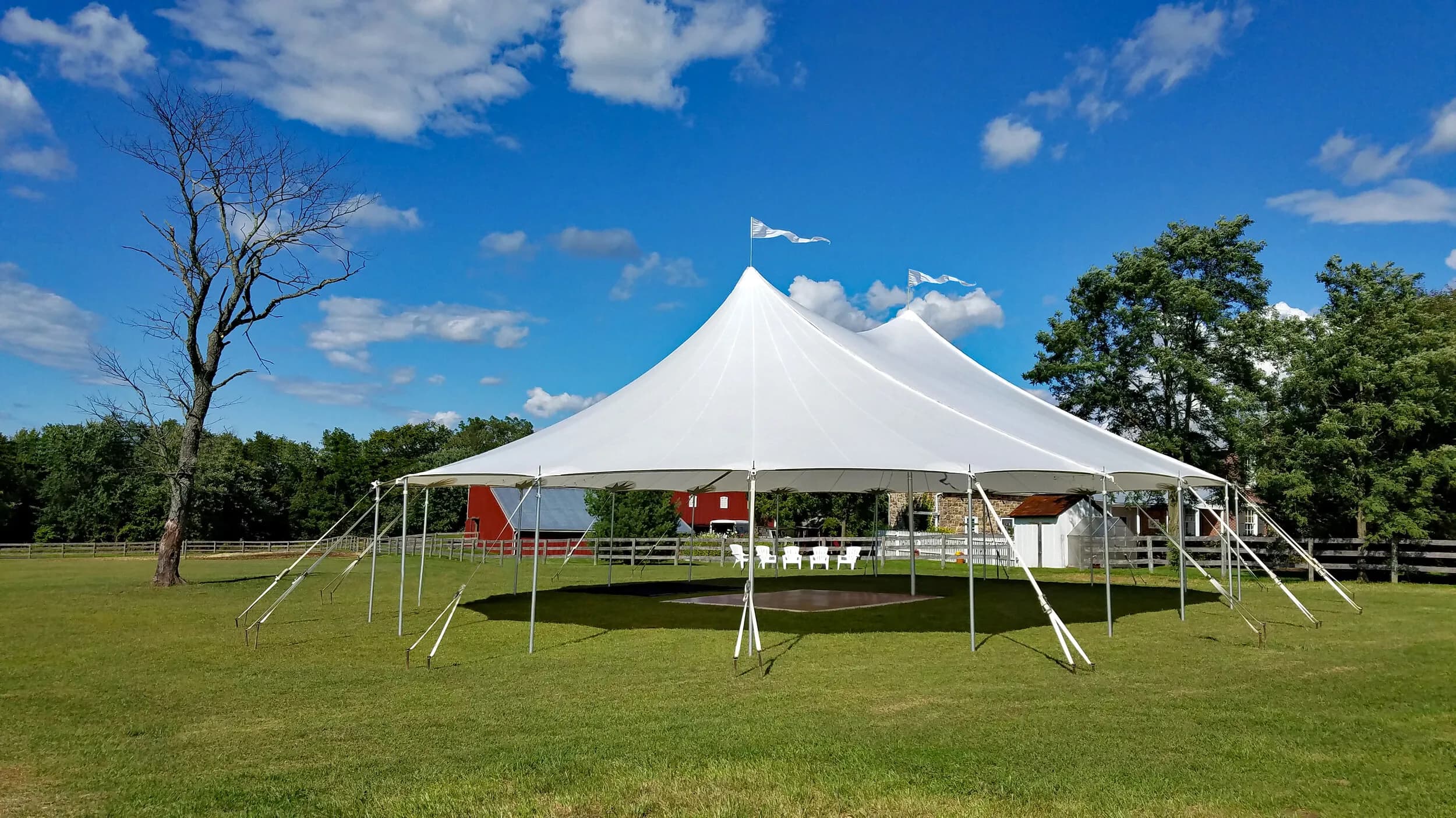A large event tent set up on a lawn
